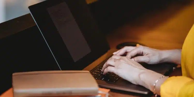 person using black laptop computer